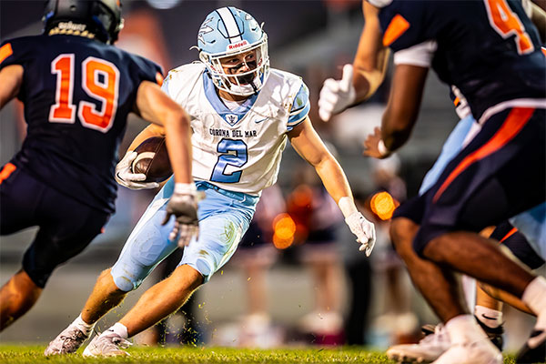 Wyatt Lucas (#2) cutting up up field to eade defenders.