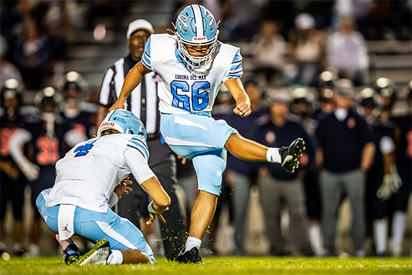 Joseph DiBella (#66) kicking for the PAT.