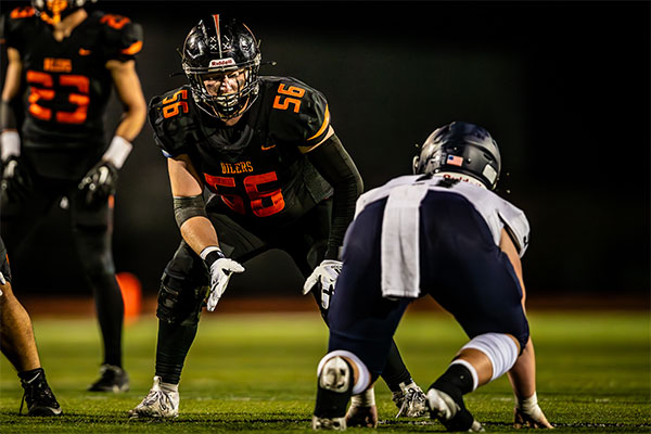 Andrew Losoya (56) getting into stance to take on Trabuco defender.