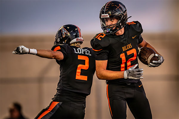 Niko Lopez (#2) and Steel Kurtz (#12) celebrate after a touchdown.