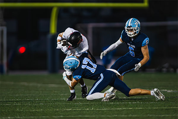 Tucker Murray (#17) and Breck Clemmer (#6) rally to the ball to stop the run.