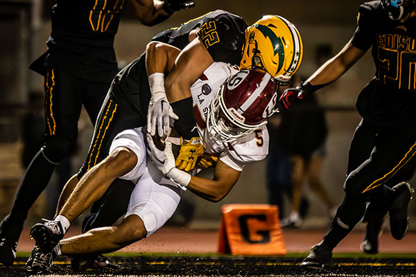 Jeremiah Ross (#22) stopping the ball carrier in his tracks.