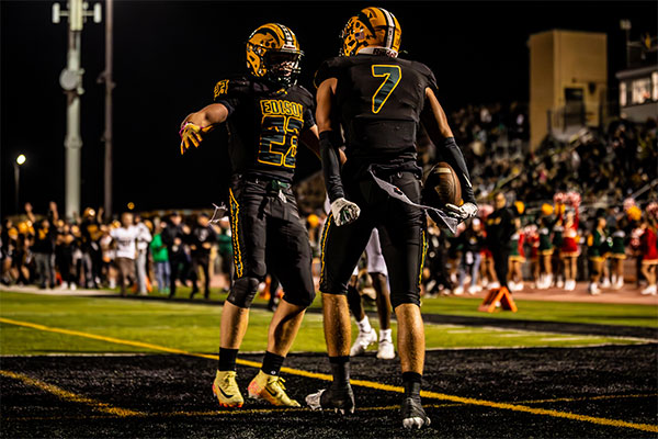 Shea Summers (#23) and Gavin Slaughter (#7) celebrate another Edison touchdown.