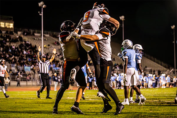 Brady Edmunds (#9) celebrating with fellow teammates.