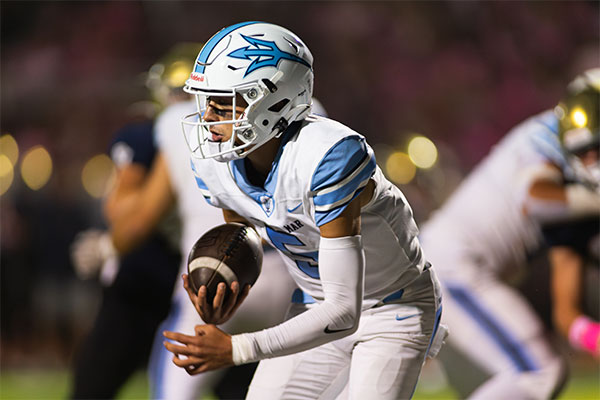 Max Nashed (#5) tucks the ball to gain some yards.