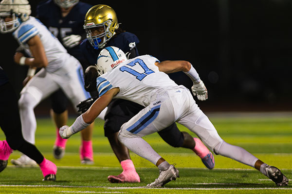 Tucker Murray (#17) gets low to take down the ball carrier.