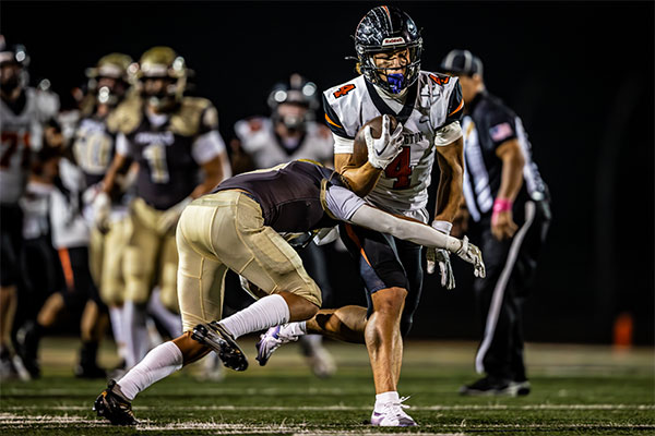 Defender attempting to stop Troy Foster (#4).