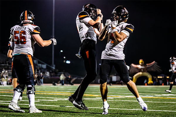 Huntington Beach Oilers celebrating a touchdown.