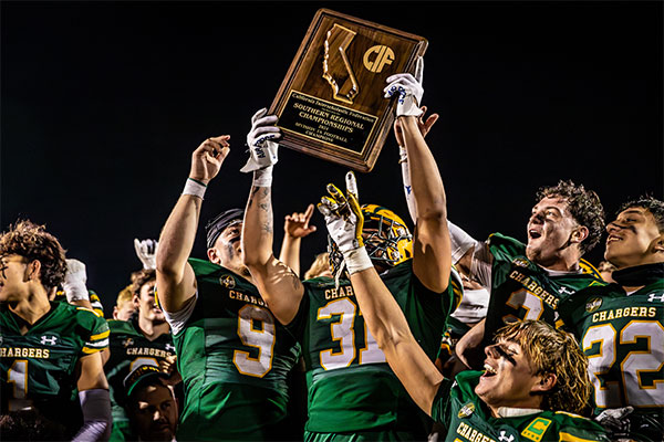 E-x-GH-E-PLayers-Holding-Up-Championship-Plaque